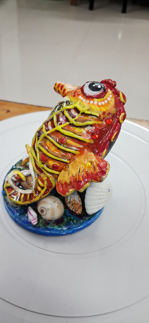 Seahorse with coral
